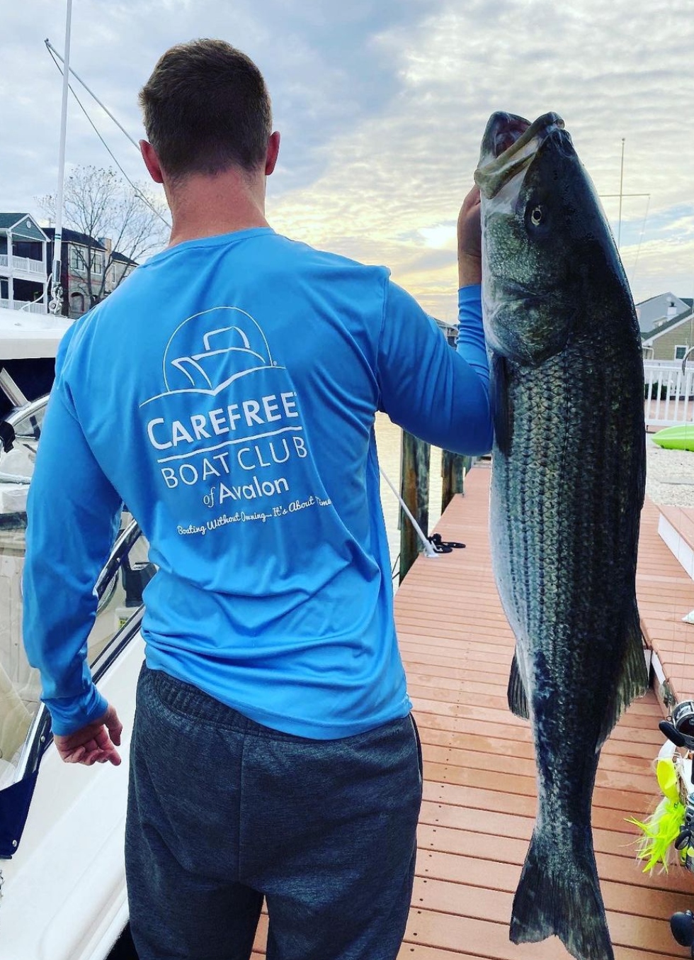 Carefree Boat Club member with striped bass